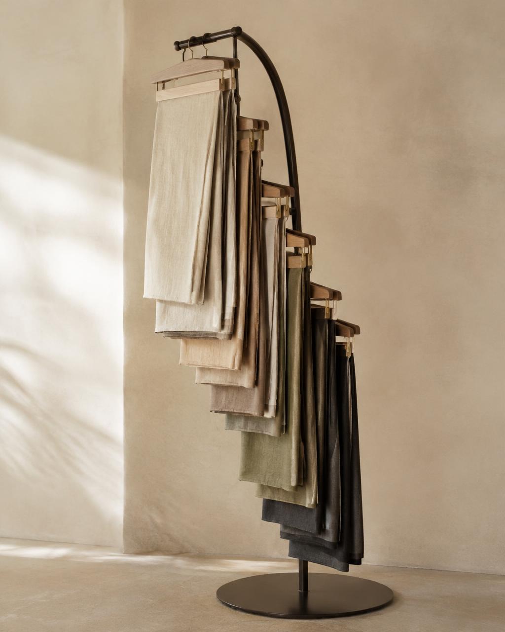 Waterfall textile display with cascading neutral fabric lengths